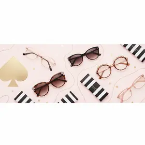 A collection of glasses and accessories on a pink background