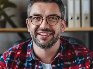Business man sitting in a chair and smiling