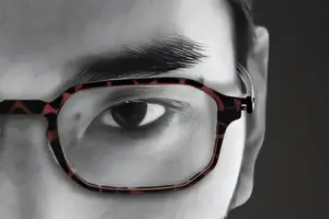 Close up of a man's eye with glasses