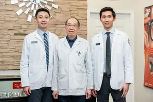 Go Family wearing lab coats