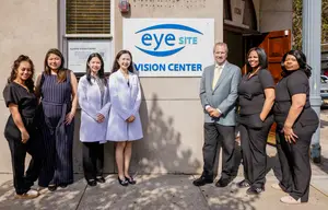 Optometrists and staffs standing outside of the Eye Site Vision Center in Hoboken, NJ.