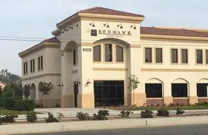 A picture of the front of a building that says Red Hawk Vision Center