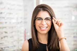 Woman wearing glasses and smiling