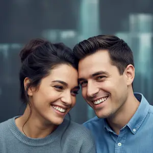 A smiling couple with their heads close to each other, possibly posing for a photo.