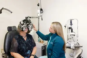 Woman having an eye exam with a doctor in an office