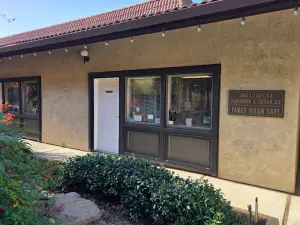 Front entrance of Family Vision Care building with red roof and sign