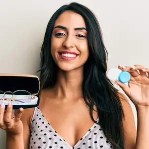 Smiling woman with contacts and glasses