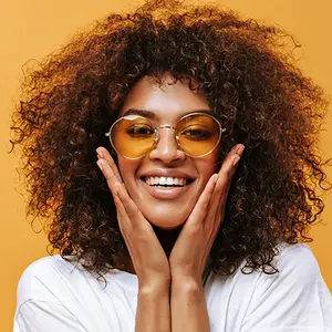 wavy hair smiling wearing sunglasses