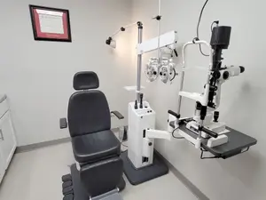 Interior of a medical clinic with an optometrist chair and equipment