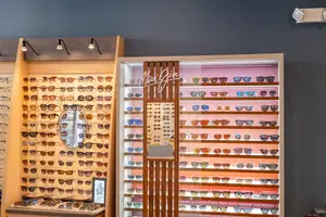 A display of sunglasses with a sign reading Maui Jim