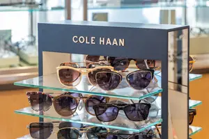 Cole Haan sunglasses on display in a store