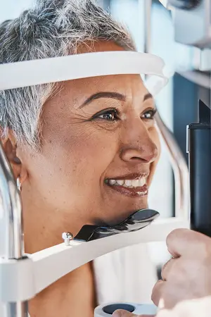 A woman getting her eyes checked by an eye doctor