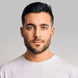 man with beard looking into the camera