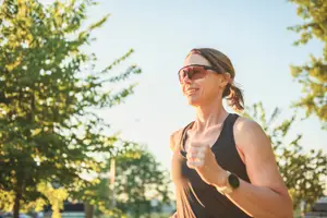 A woman running in a park during the daytime