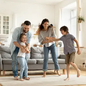 happy family playing funny game having fun together with little son and daughter in modern living room