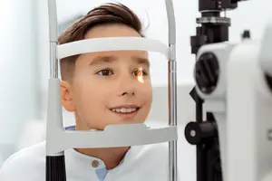 young boy having pediatric eye exam