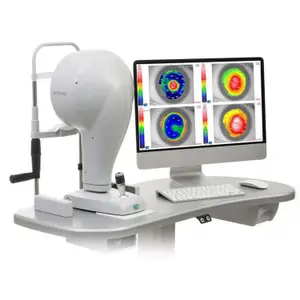 An OCT device with a monitor displaying three images of an eye, a keyboard, and a mouse are on a desk.