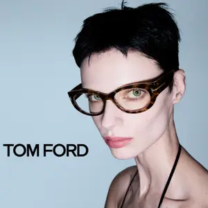 A model wearing Tom Ford glasses in a studio shot