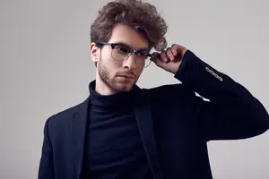 Man wearing black turtleneck and glasses