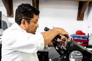Technician adjusting a microscope in a laboratory