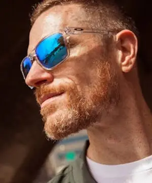 man with beard and sunglasses smiling