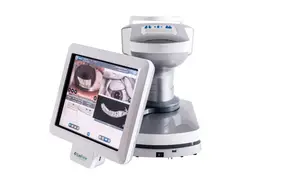 A white digital display screen on a gray and white medical device shows an image of a tooth and gums with a smiling face on the screen