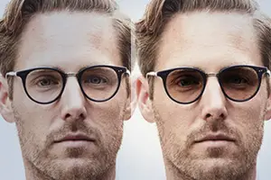 Two men wearing glasses, one with clear lenses and the other with polarized lenses, both have beards and mustaches, and they are looking at the camera with serious expressions.