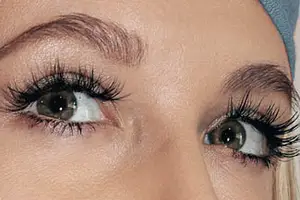 Close up of a woman's eyes with eyelashes and eyebrows visible.
