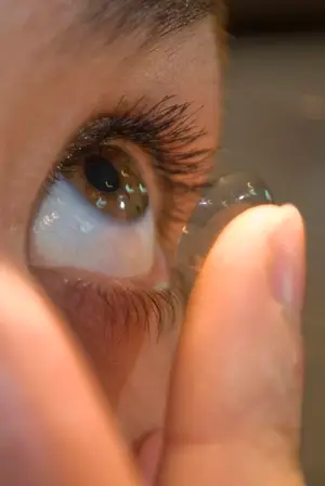 A close up of a person's eye with a contact lens in it.