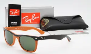 An orange and black pair of Ray-Ban Wayfarer sunglasses are shown with their box and case on a white background.