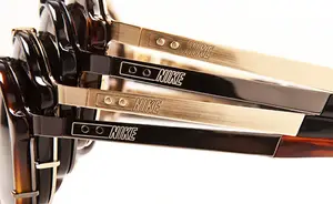 Four pairs of sunglasses with the brand name Nike on the temples