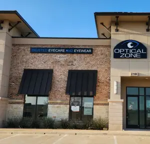 Optical Zone building with brick walls and black awnings