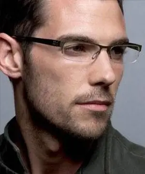 business man adjusting glasses