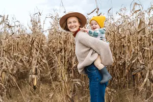 A woman in a hat and sweater satisfied with her eyecare at Eyecare of Marietta in Marietta, GA.