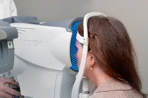 woman getting her eyes checked at an eye exam