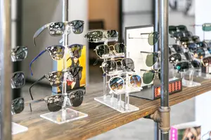 A table filled with sunglasses on display in a shop