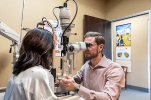 Man having an eye exam with a female doctor